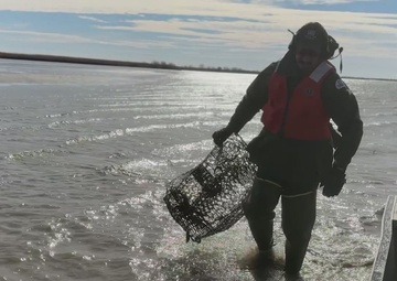 Wallisville Lake Project staff round up derelict crab traps