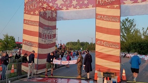 1st place Semper 5ive male runner crosses finish line
