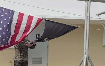 U.S. Marines raise flag over U.S. Coast Guard Forces Micronesia following Typhoon Mawar