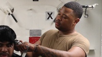 Sailor Serves as Ship's Barber Aboard USS Milius (DDG 69)