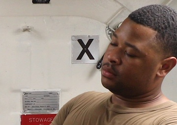 Sailor Serves as Ship's Barber Aboard USS Milius (DDG 69)