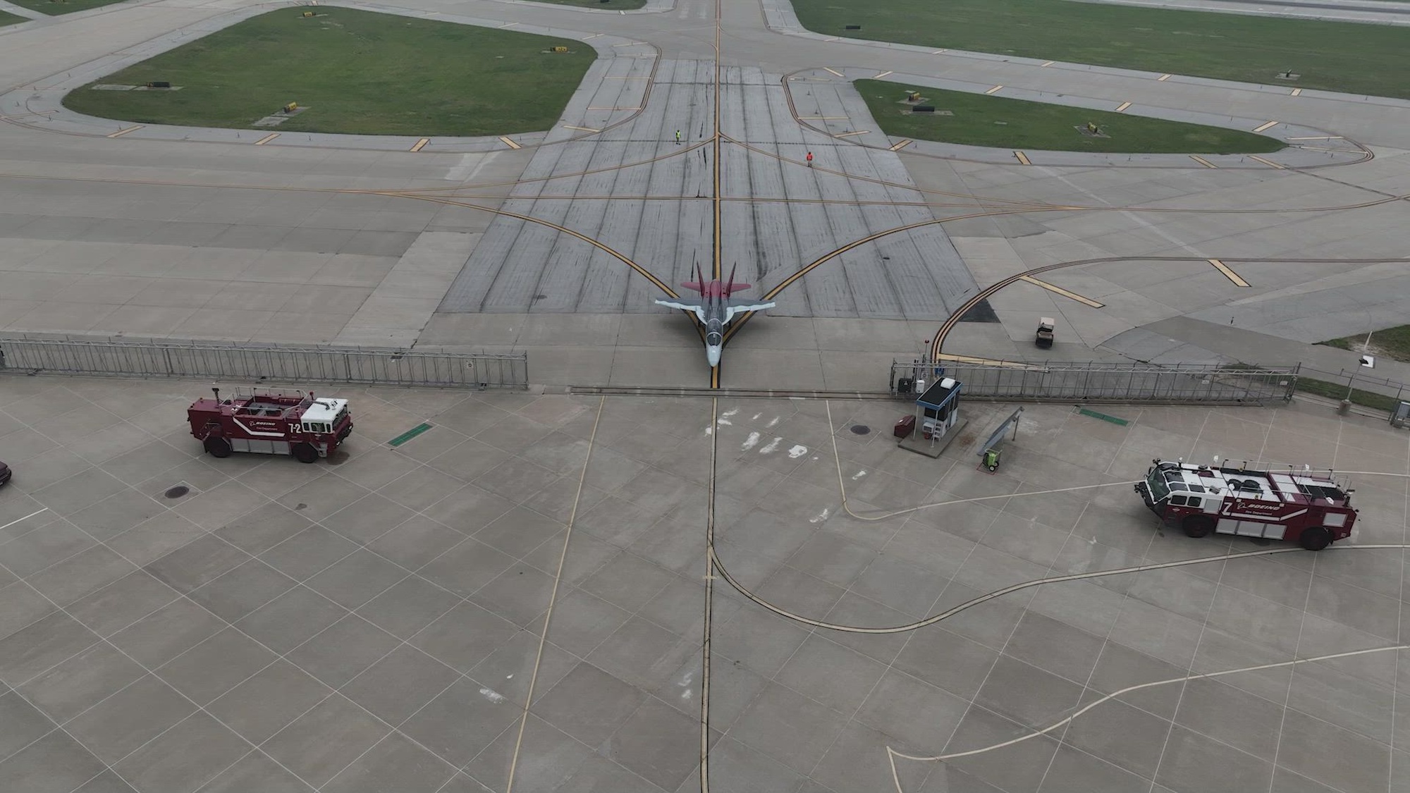 The T-7A Red Hawk piloted by Maj. Bryce Turner, 416th Flight Test Squadron, receives a water salute at the Boeing aircraft delivery center in St. Louis, Missouri, June 28. Turner became the first Air Force pilot to fly the T-7A Red Hawk, following a test flight the same day. (Video courtesy of Boeing)