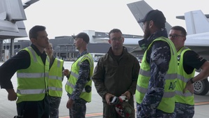 B-Roll: U.S Marines and Australian Airmen load CATM-120 Missiles together