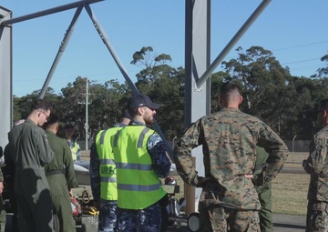 B-Roll: U.S. Marines and Australian Airmen load Missiles on Joint Strike Fighters together 