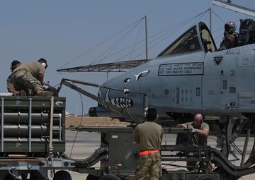 A-10 crew demonstrates loading ammunition