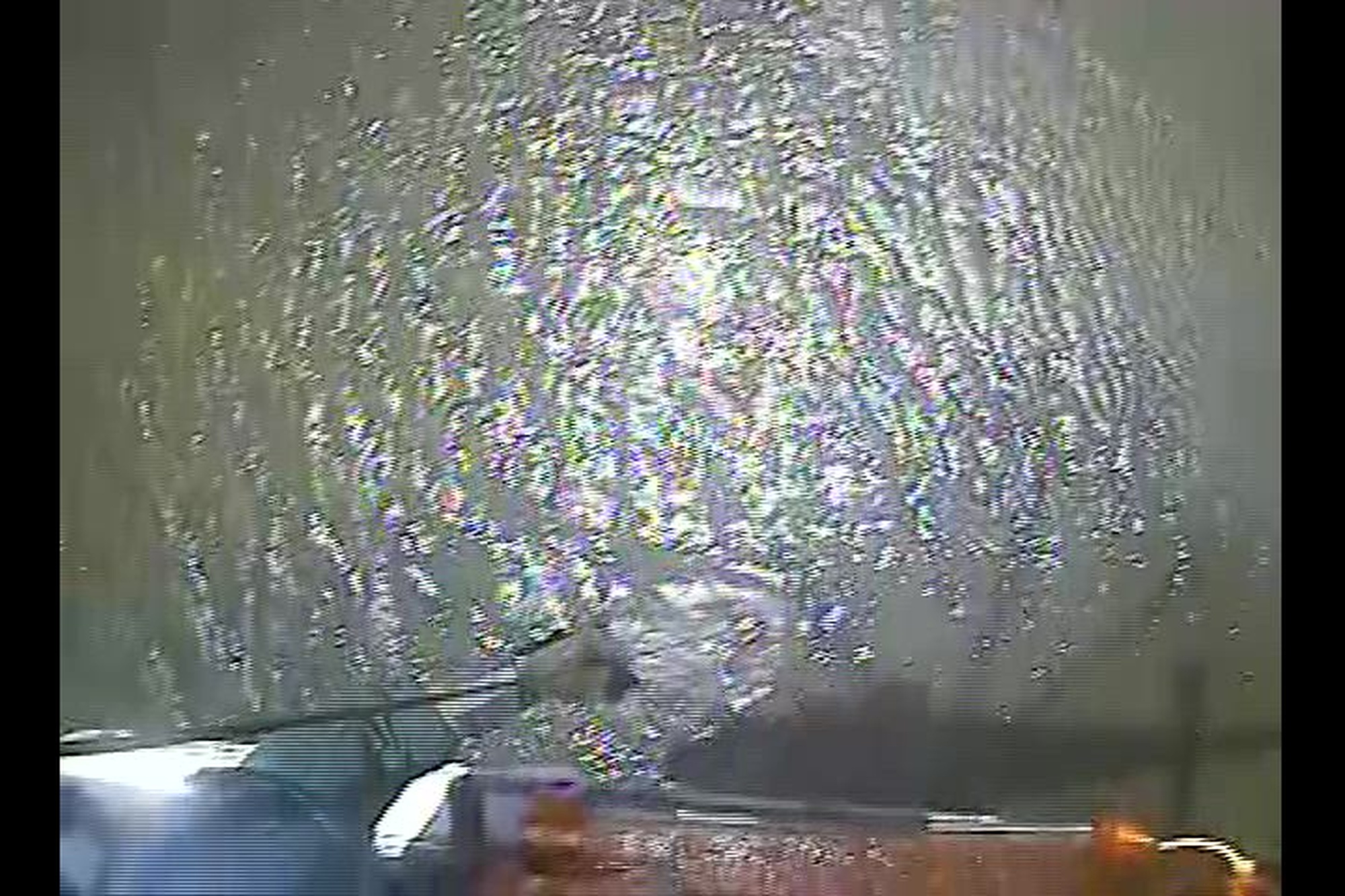 An MH-65 Dolphin helicopter crew from Coast Guard Air Station Corpus Christi hoists a kite surfer who was beset by weather off Bird Island near Port Mansfield, Texas, July 15, 2023. On-scene weather conditions were 2-foot seas and winds of 17 mph. (U.S. Coast Guard video, courtesy Air Station Corpus Christi)