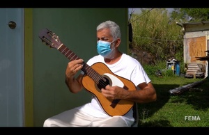 Resilience and Harmony: Don Mariano's Melody of Hope Echoes from his Rebuilt Home in San Germán Mountains, Thanks to Collaborative Efforts of FEMA, Lions Club, and SACE