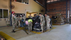 Combined members load, transport Airmen for Talisman Sabre 23