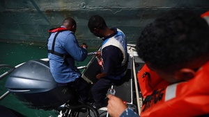 Mexican navy sailors help repair Guyana Defense Force coast guard boat