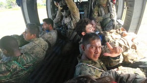 Multinational service members jump from UH60