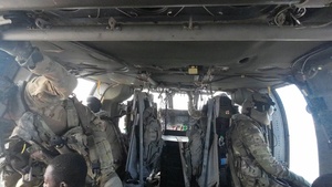 Multinational service members jump from UH60