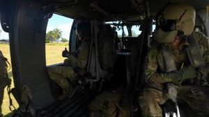 Multinational service members jump from UH60