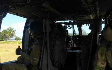 Multinational service members jump from UH60