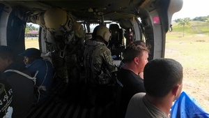 Multinational service members jump from UH60