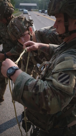 Soldiers from units within the XVIII Airborne Corps, rappel down a cliff face as part of the Best Squad Competition 2023