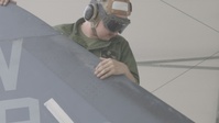 U.S. Marines with Marine Aircraft Group 14 maintain AV-8B Harrier II aircraft (B-Roll)