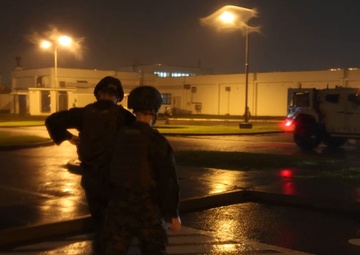 U.S. Marines with 3rd Maintenance Battalion Conduct a base damage assessment during a typhoon