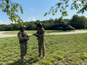 UH-60 Black Hawks land to extract officer candidates after training