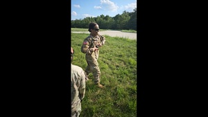 Soldier throws smoke signal for incoming Black Hawks