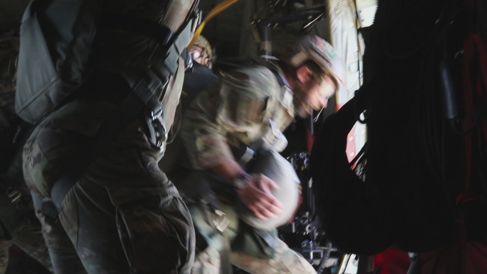 A U. S. Army Soldier performs a static-line jump from a