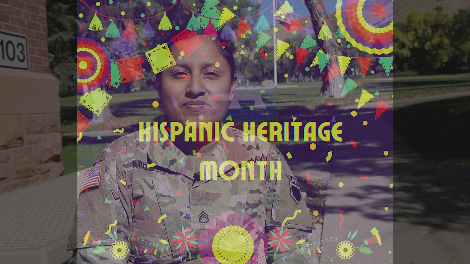 Graphic with Hispanic decorations overlies an image of a soldier in uniform standing outdoors.