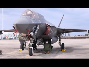 U.S. Marines with Marine Fighter Attack Squadron (VMFA) 542 load missiles