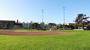 Service Members Compete with Local Teams in a Softball Tournament