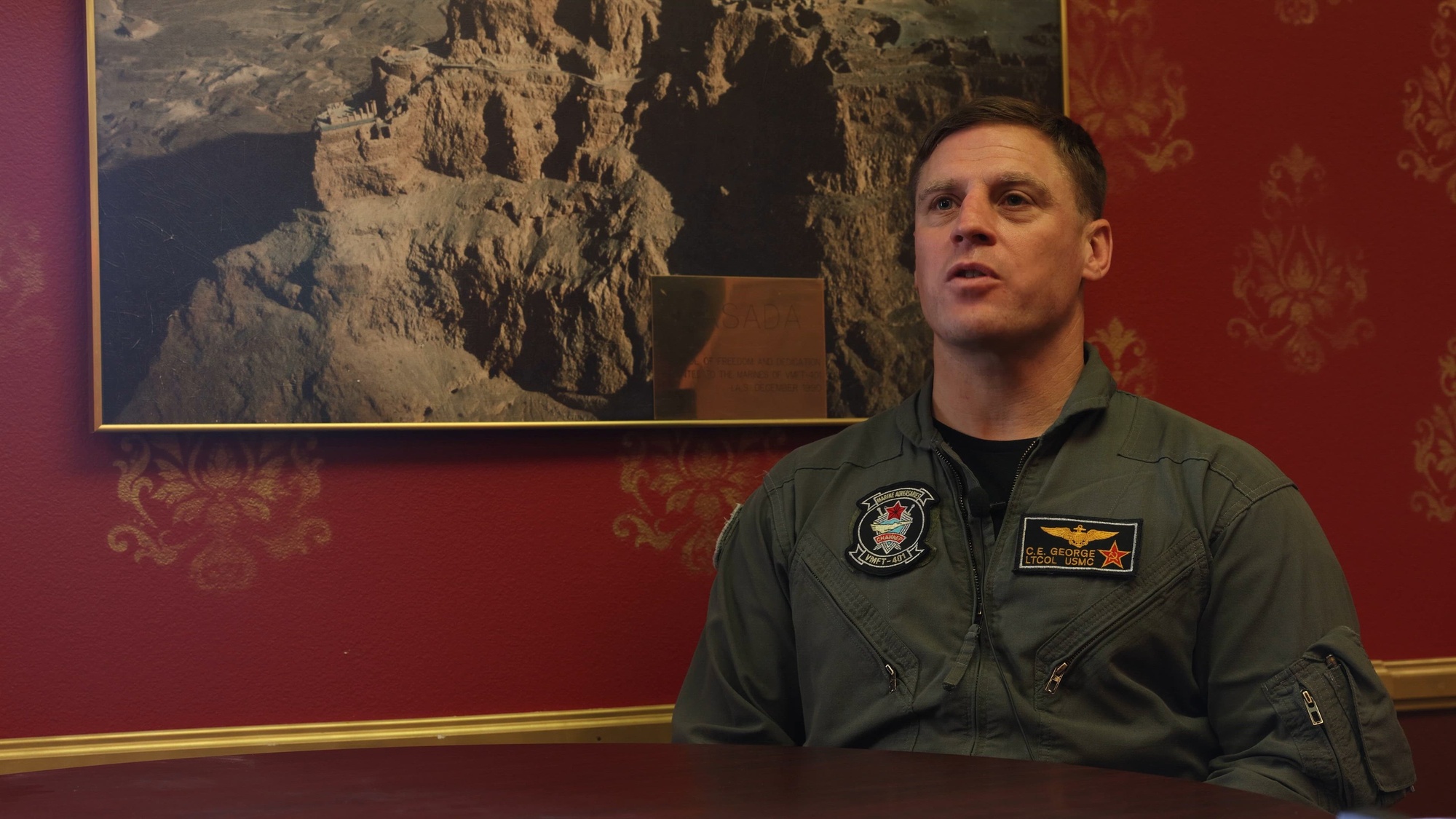 U.S. Marines Corps Lt Col. Charles George, Commanding Officer, Marine Fighter Training Squadron (VMFT) 401 conducts an interview on Marine Corps Air Station Yuma, Arizona, Oct. 13, 2023. VMFT-401 is the only adversary squadron with the mission to act as the opposing force in simulated air combat. (U.S. Marine Corps video by Lance Cpl. Elizabeth Gallagher)