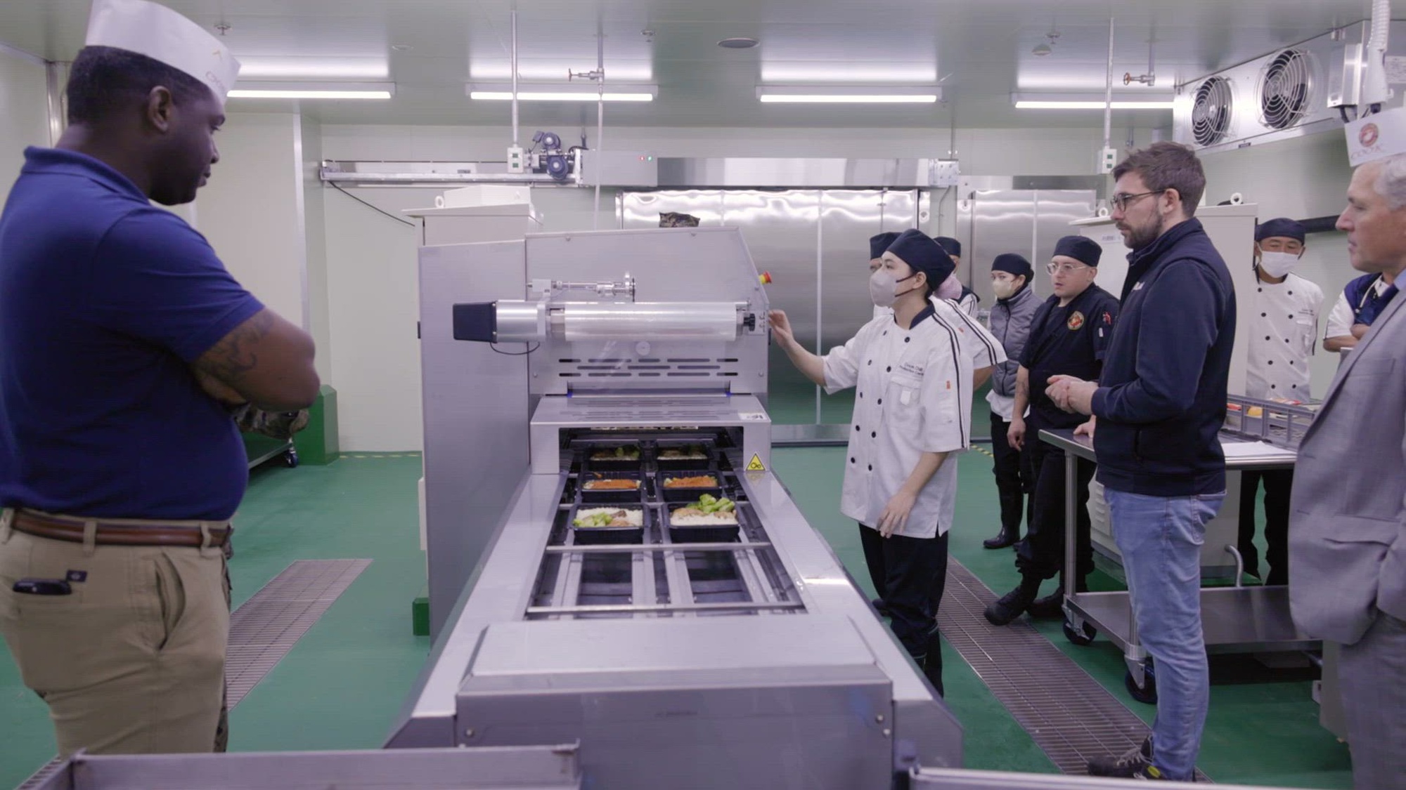 The Cook-Chill Production Center located on Camp Hansen is incorporating new packaging machines for food distribution across Okinawa, Japan, Nov. 15, 2023. U.S. Marines stationed or deployed to Okinawa will be provided with contemporary food options that were not previously available. (U.S. Marine Corps video by Cpl. Vincent Pham)