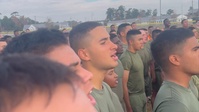 U.S. Marines with Marine Corps Combat Service Support Schools sing the Marines' Hymn