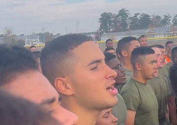 U.S. Marines with Marine Corps Combat Service Support Schools sing the Marines' Hymn