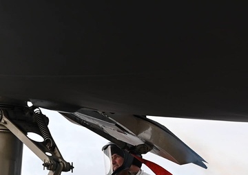 Crew chiefs service the LOX system of a C-17