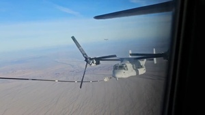 A U.S. Marine Corps MV-22B Osprey conducts tilt-rotor air-to-air refueling with a U.S. Air Force HC-130J Combat King II