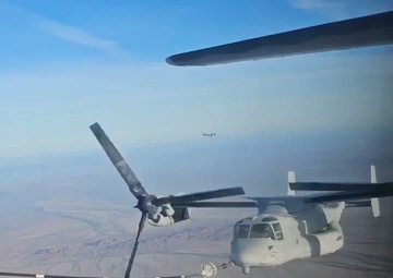 A U.S. Marine Corps MV-22B Osprey conducts tilt-rotor air-to-air refueling with a U.S. Air Force HC-130J Combat King II