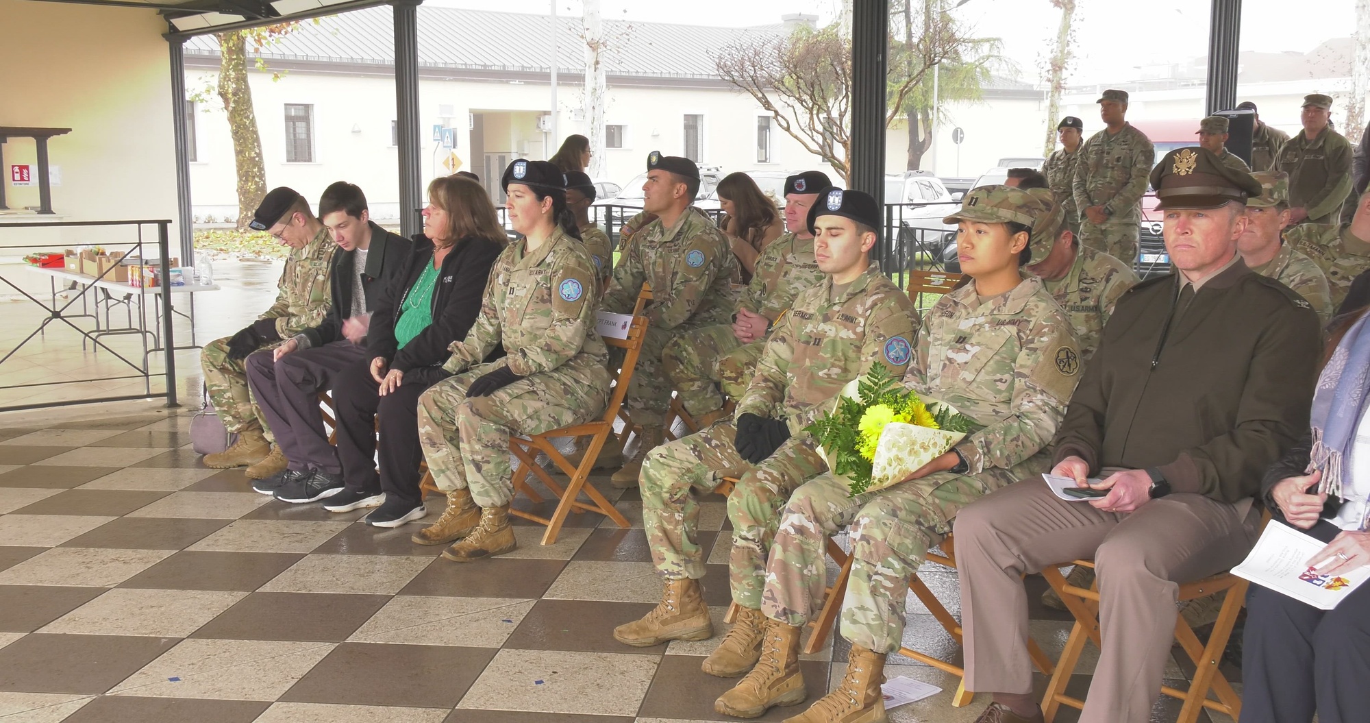 U.S. Army Lt. John G. Wildt, commander of the 307th Military Intelligence Battalion, Capt. Maria N. Frank, outgoing company commander of Headquarters & Headquarters Detachment, 307th MI Battalion, Capt. Nicholas D. Bermudez, incoming commander of HHD, 307th MI Battalion, and Sgt. 1st Class Julius A. Smith, HHD, 307th MI Battalion, participate in the change of command ceremony at Caserma Ederle, Vicenza, Italy Dec. 14, 2023. (U.S. Army video by Paolo Bovo)