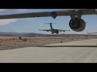 Marines with 3rd LAR load tactical vehicles onto Air Force C-17 Globemaster III cargo aircraft