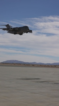 Marines with 3rd LAR load tactical vehicles onto Air Force C-17 Globemaster III cargo aircraft