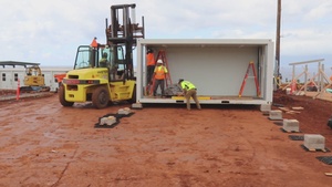 USACE contractors install a classroom at temporary school construction site