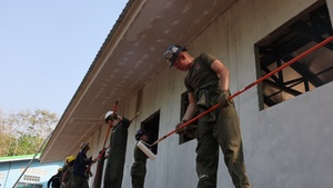 Cobra Gold 24; Marines with Marine Wing Support Squadron 171 paint a new building at the Ban Prakaet School