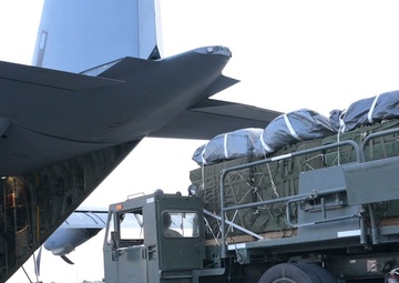 Airmen load AFCENT C-130s with humanitarian aid bound for Gaza