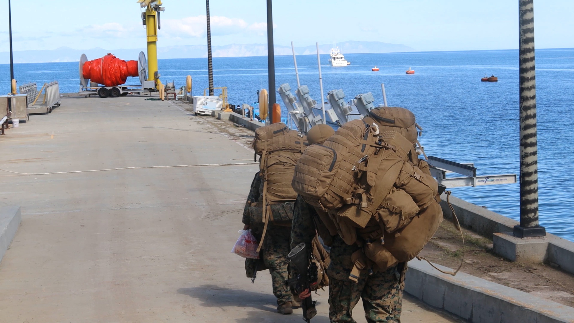 U.S. Marines with Marine Wing Support Squadron 373, Marine Air Control Group 38, 3rd Marine Aircraft Wing, prepare to sail from San Clemente Island to Camp Pendleton, California, using a contracted civilian fishing vessel during phase III of Strategic Mobility Exercise (STRATMOBEX) II at San Clemente Island, California, Feb. 12, 2024. MWSS-373 leveraged a contracted civilian fishing vessel among several transportation methods to showcase evolving  Force Design 2030 and Expeditionary Advanced Base Operations concepts. During STRATMOBEX II, MWSS-373 demonstrated mastery of scalable air ground support such as expeditious airfield damage repair, forward arming and refueling point, integrated engineering and explosive ordnance disposal operations.