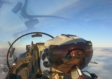 U.S. Marine Corps pilot with Marine Fighter Attack Squadron (VMFA) 312 conducts fixed-wing air-to-air refueling during Exercise Nordic Response 24 (B-Roll)