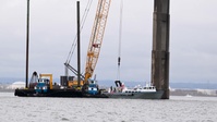 Unified Command crews remove debris from the channel