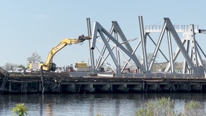 Large section of Francis Scott Key Bridge processed into smaller pieces at Sparrows Point, MD
