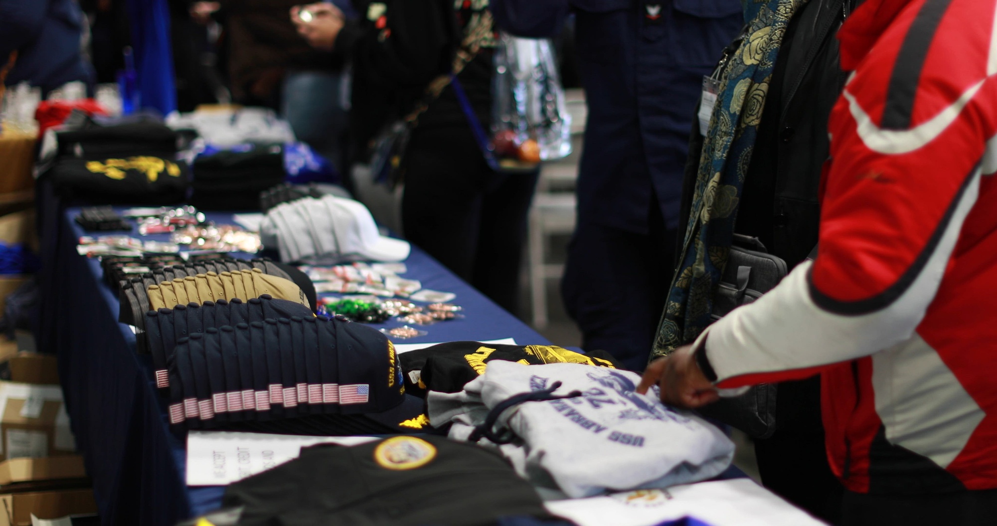 240413-N-CO548-1001 PACIFIC OCEAN (April 13, 2024) Visitors shop for merchandise and tour demonstrations during a friends and family day aboard the Nimitz-class aircraft carrier USS Abraham Lincoln (CVN 72). The friends and family day cruise provides an opportunity for Abraham Lincoln to demonstrate its combat abilities and showcase daily life aboard a U.S. Navy Ship. (U.S. Navy video by Mass Communication Specialist 2nd Class Alonzo Martin-Frazier)