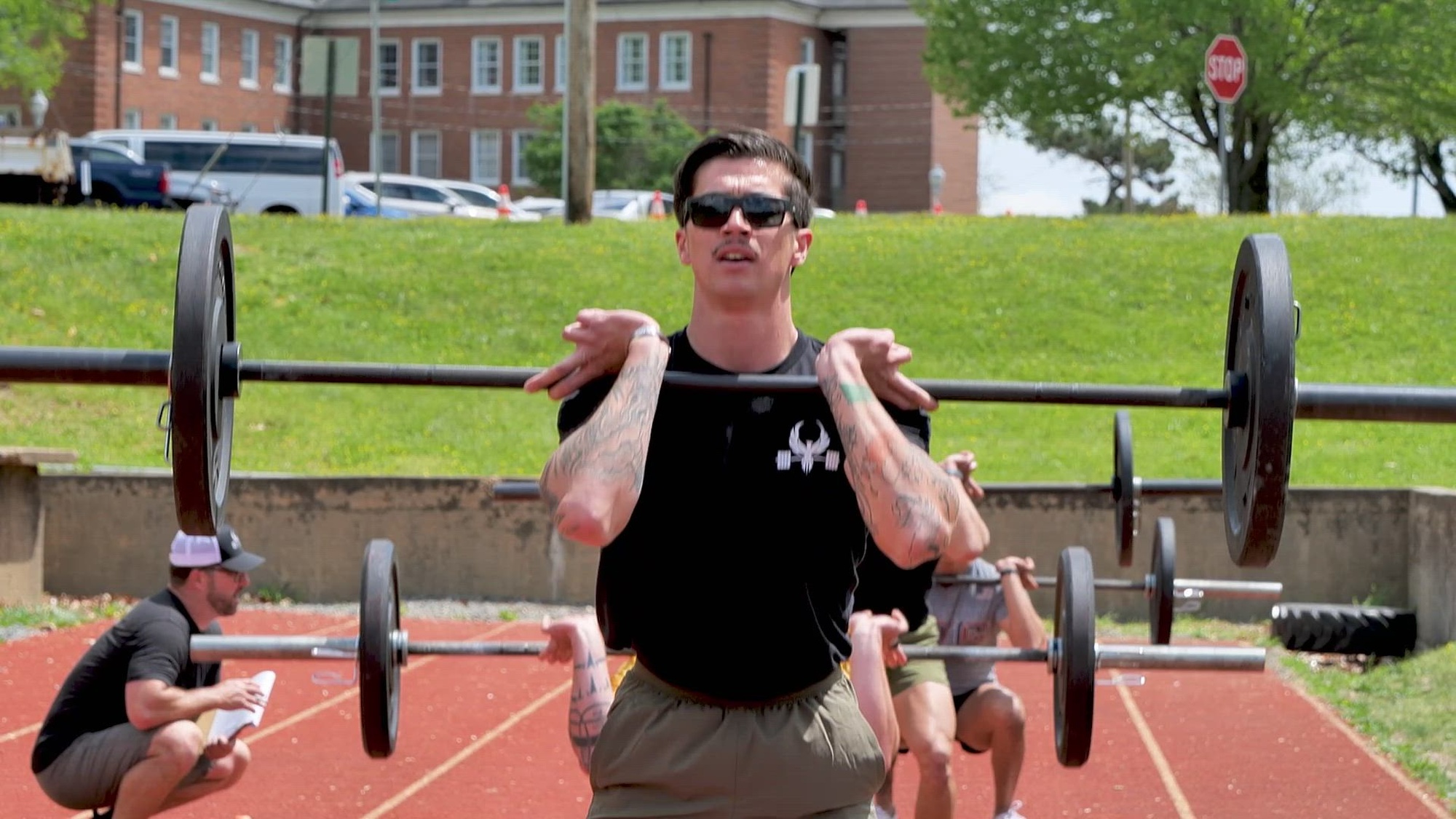 U.S. Marines and Royal Marines compete in the Double-up competition during the 2024 Fittest Instructor Competition on Marine Corps Base Quantico, Virginia, April 24, 2024. The Fittest Instructor competition brings Marines from different units together to compete in a variety of events to include, a blind ruck march, a swimming competition, strength and endurance exercises, a Royal Marine physical fitness test, a modified biathlon, and Kim’s double obstacle course. (U.S. Marine Corps Lance Cpl. Keahi J. Soomanstanton)