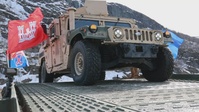 U.S. Navy Seabees join forces with the U.S. Army and Norway for bridge construction