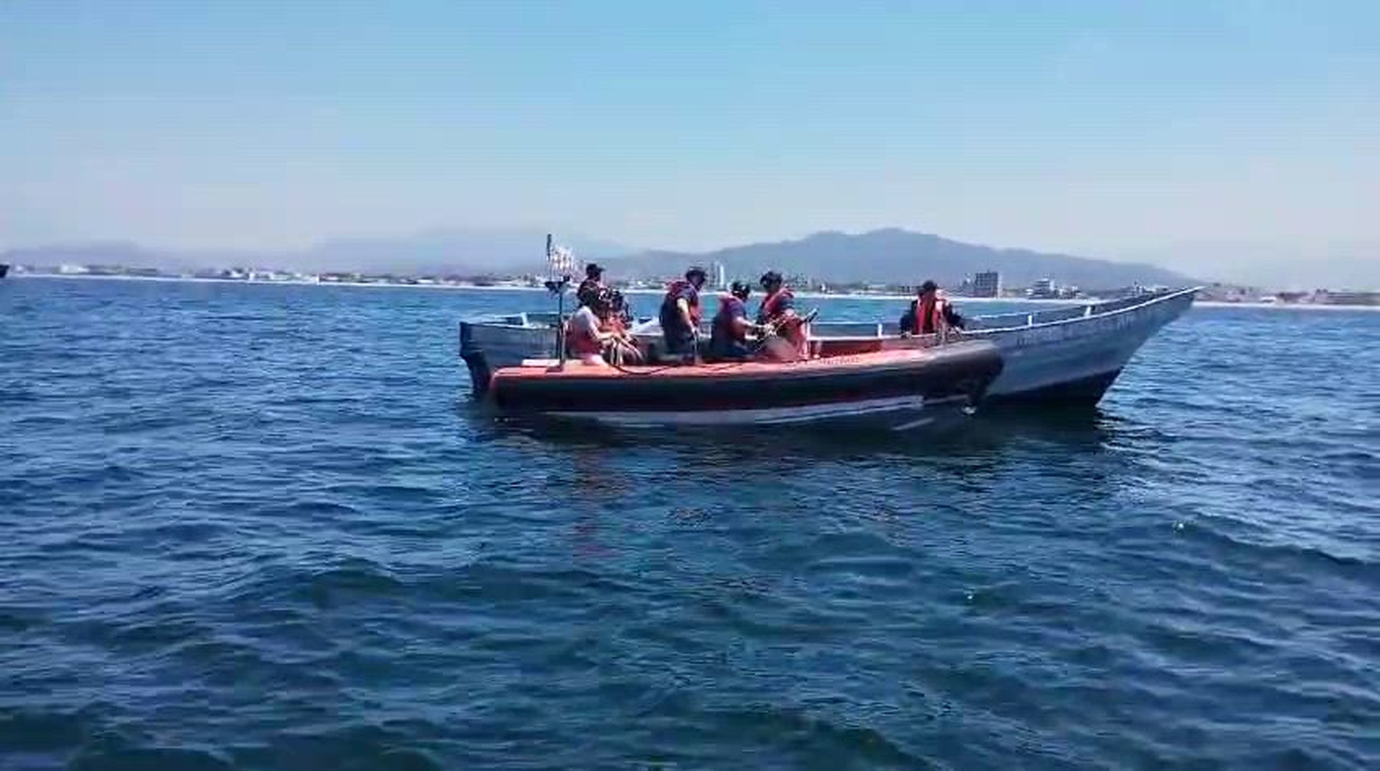 U.S. Coast Guard Cutter Forrest Rednour WPC-1129 crewmembers come alongside a panga boat operated by a Secretaría de Marina (SEMAR) as part of a search and rescue exercise in Manzanillo, Mexico, April 30, 2024. The exercise was conducted to interoperability among the two neighboring nations. (U.S. Coast Guard courtesy photo/released)