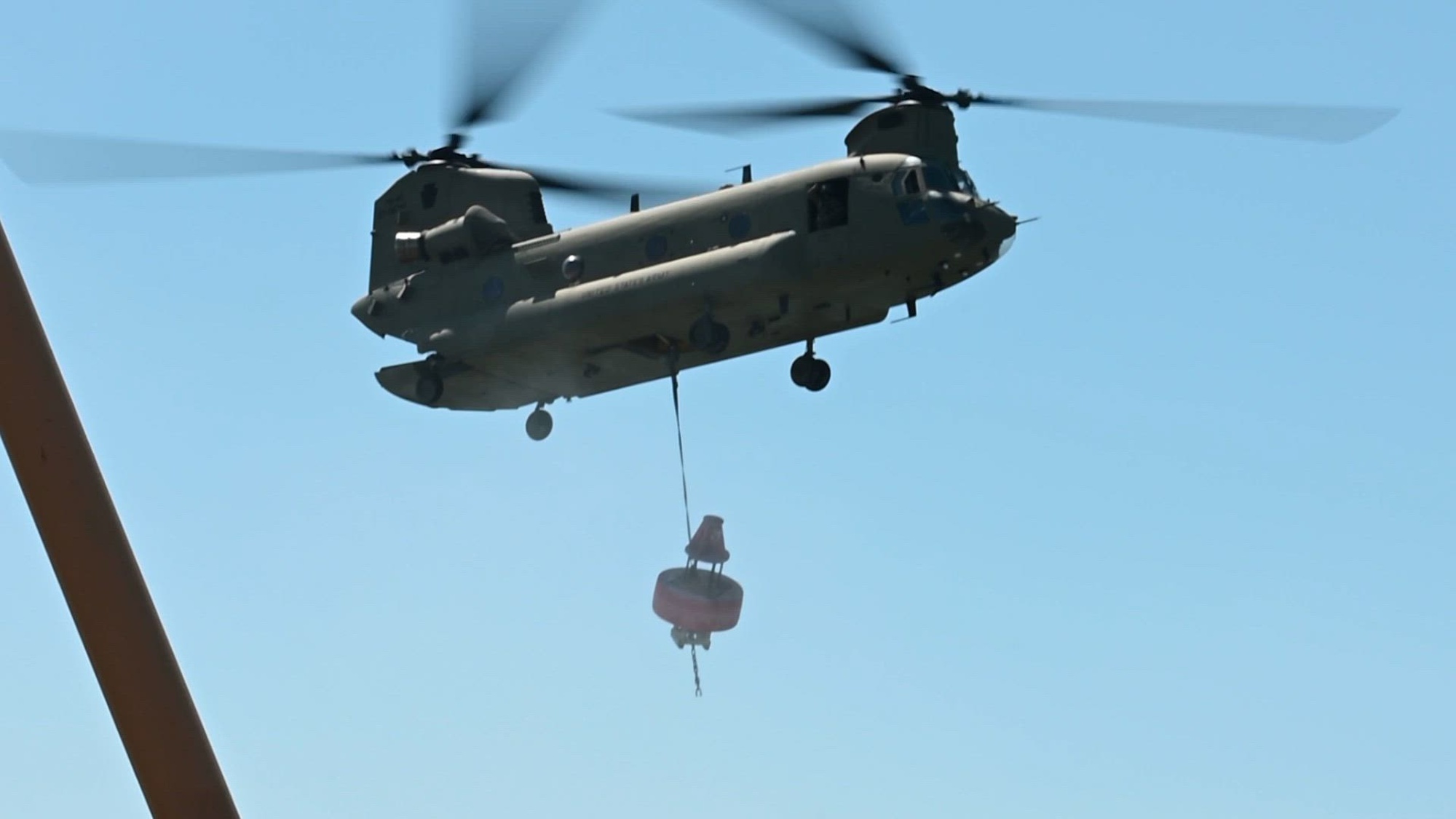 The crew of U.S. Coast Guard cutter William Tate coordinated with a Pennslvania Army National Guard 28th Expeditionary Combat Aviation Brigade Chinook helicopter aircrew to retrieve a beached buoy from Cape May, New Jersey&#39;s shore, May 1, 2024. The beached buoy was brought back to U.S. Coast Guard Sector Delaware Bay in Philadelphia for repairs and future use. (U.S. Coast Guard video by Petty Officer 3rd Class Carmen Caver)