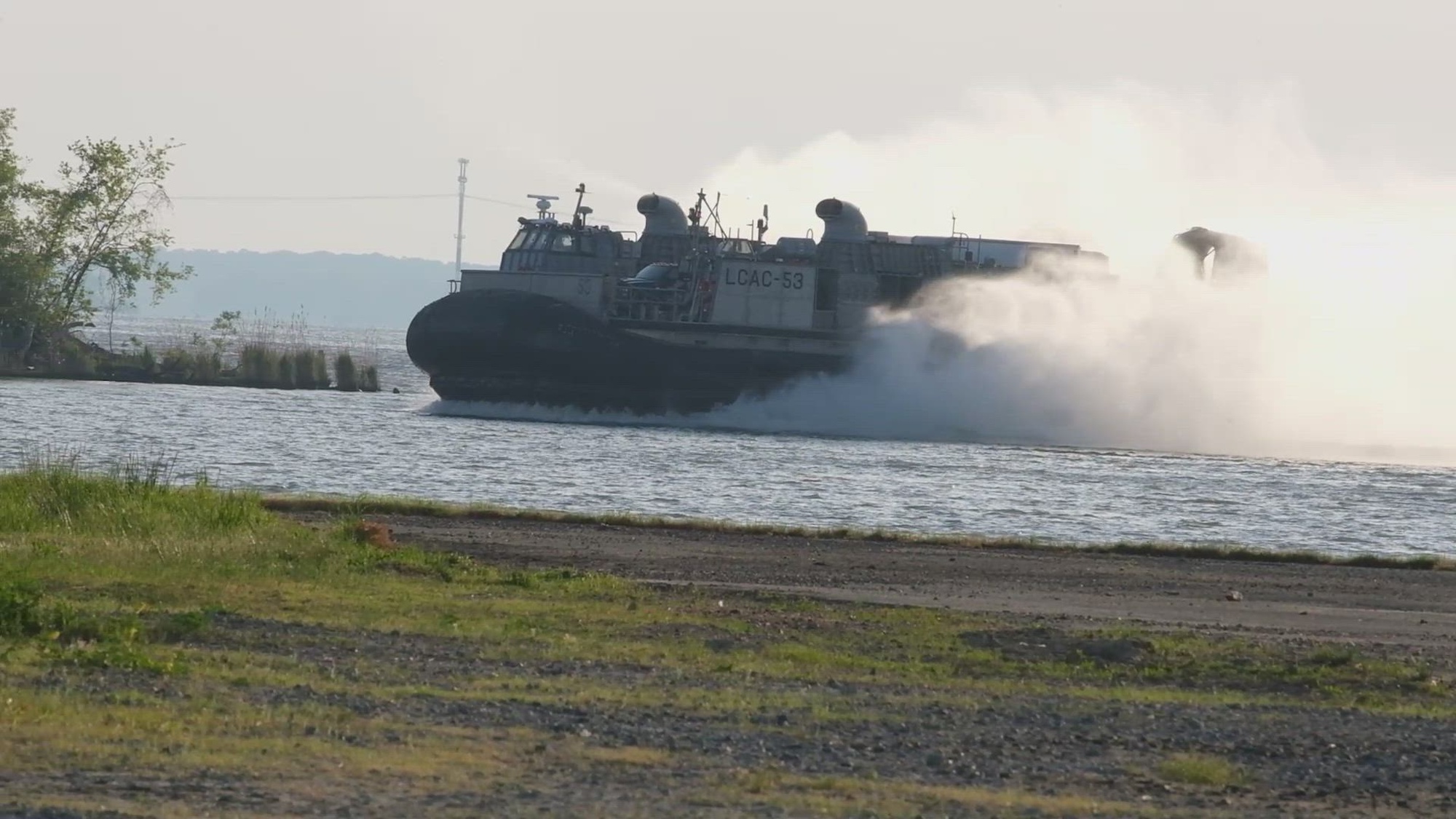 U.S. Marines and Sailors conduct a Landing Craft Air Cushion landing on Marine Corps Air Facility on Marine Corps Base Quantico, Virginia, May, 3, 2024. The LCAC is a class of air-cushioned landing craft used by the Navy to transport weapons systems, equipment, cargo and personnel from ship to shore and across the beach. (Marine Corps video by Cpl. William Tucker)